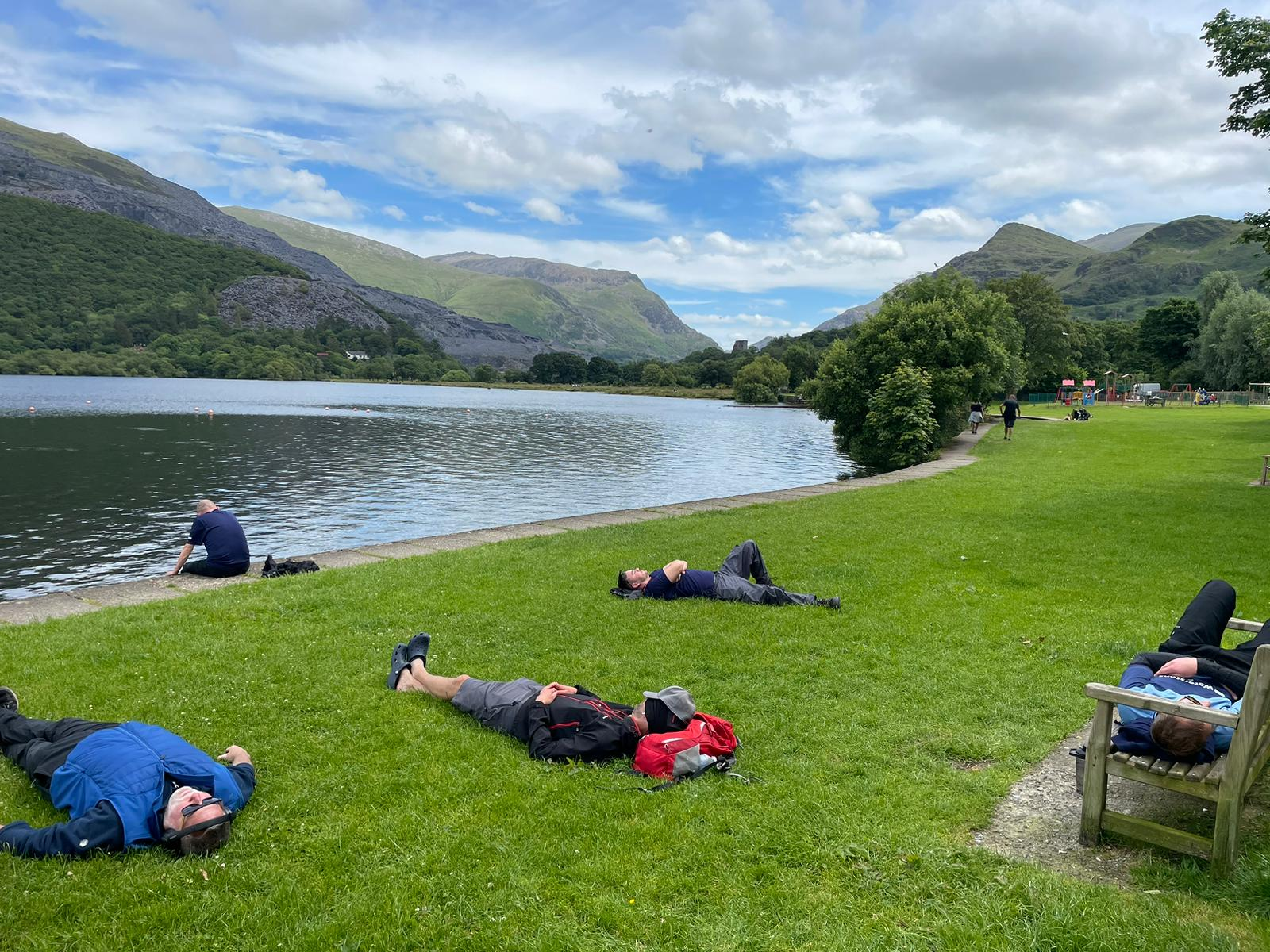 the team lying on the grass